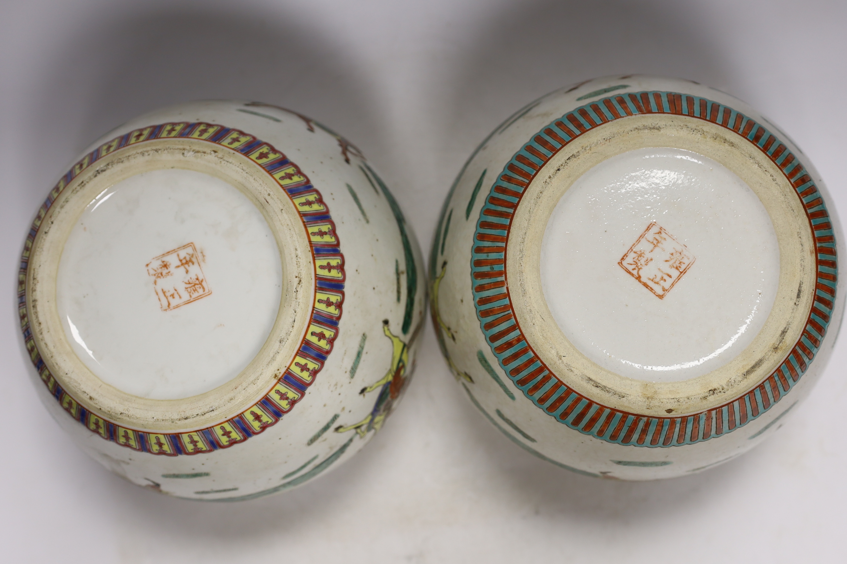 A pair of Chinese famille rose jars and covers